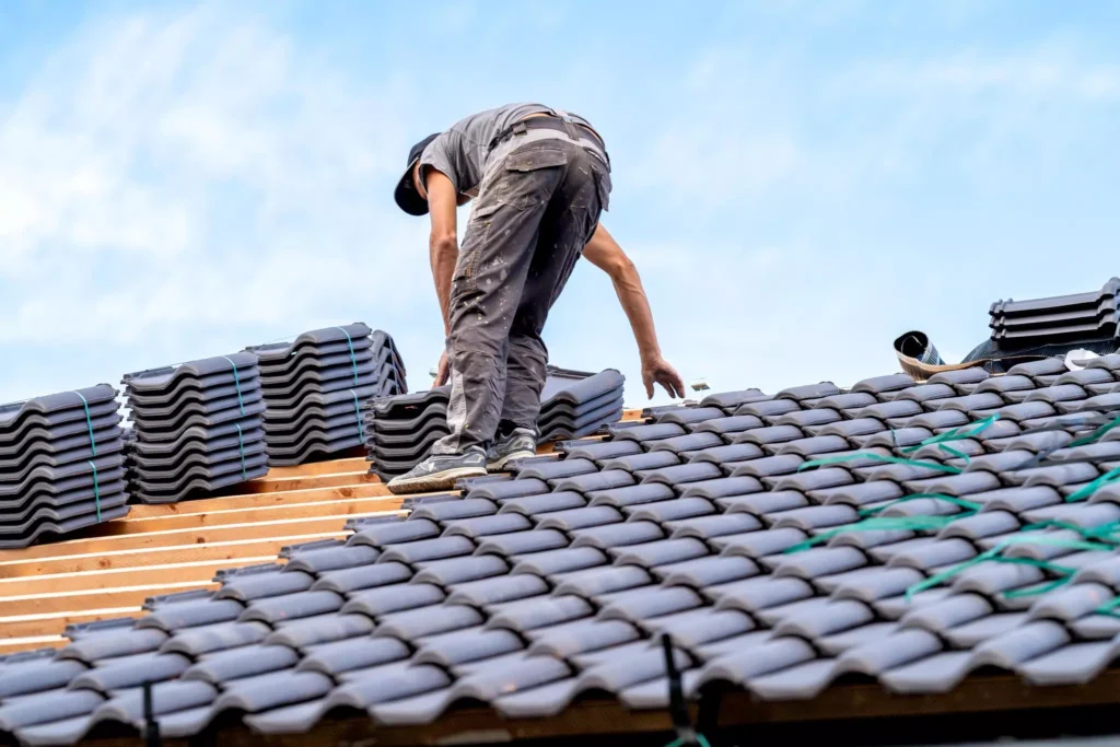 Craftsman installing ceramic roof tile